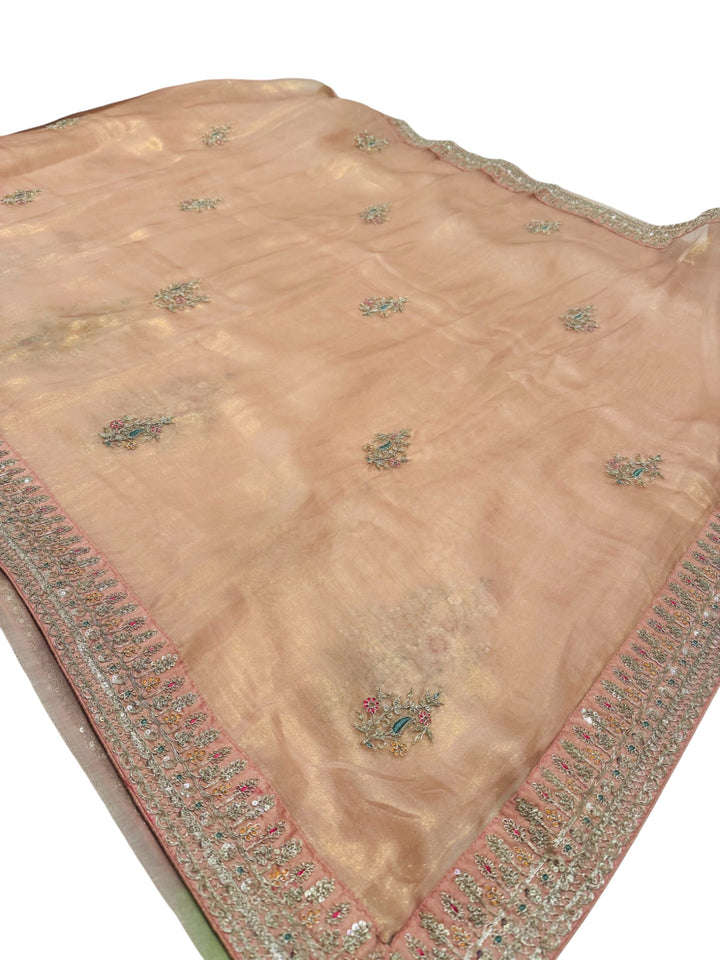 Soft Hatted Tissue Saree in Pastel Peach with Teal Embroidered Blouse