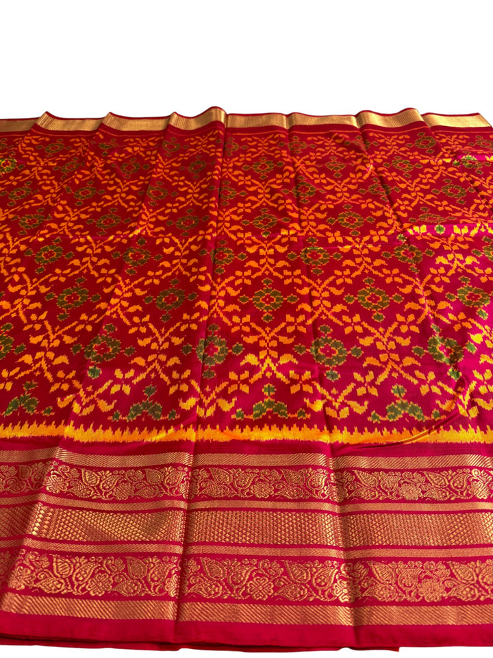 Premium Ikat Silk Saree in Vibrant Orange & Pink Floral Weave